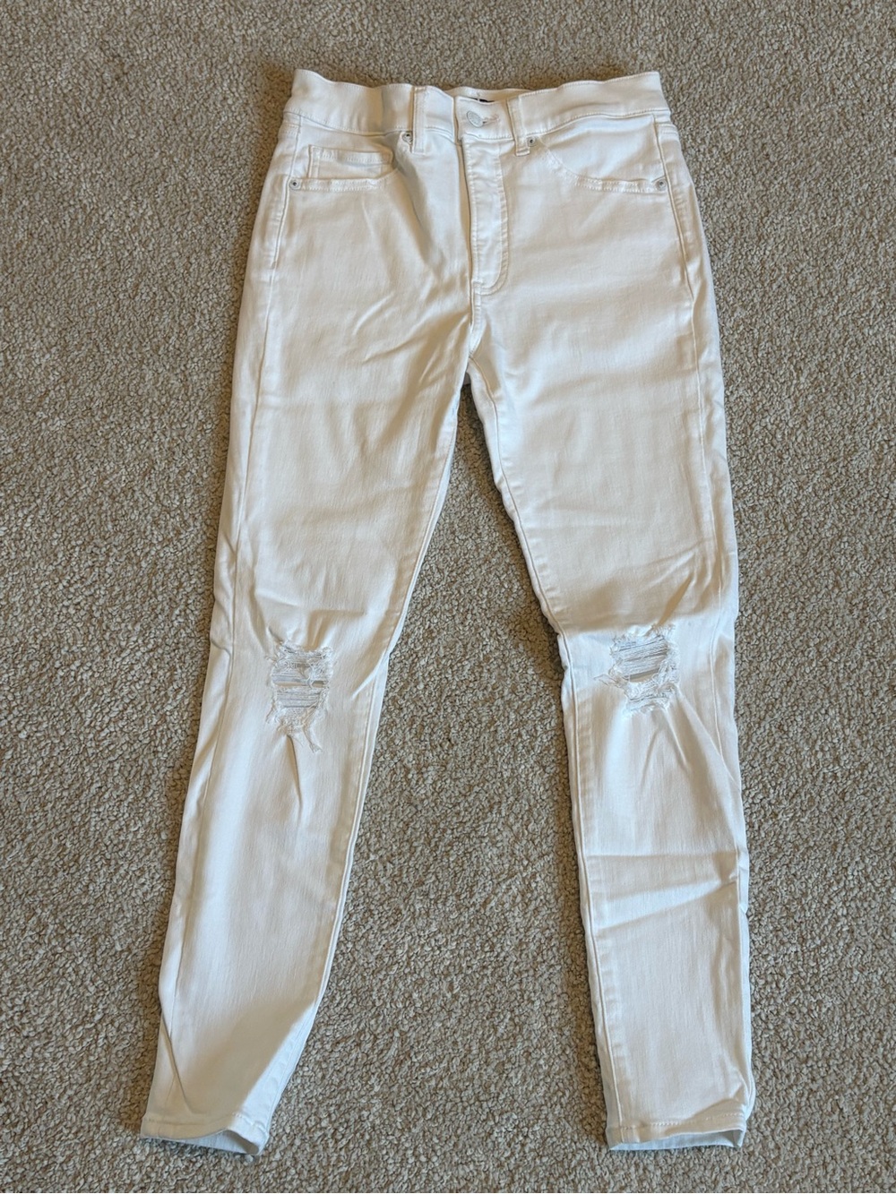 Express white skinny jeans with distress